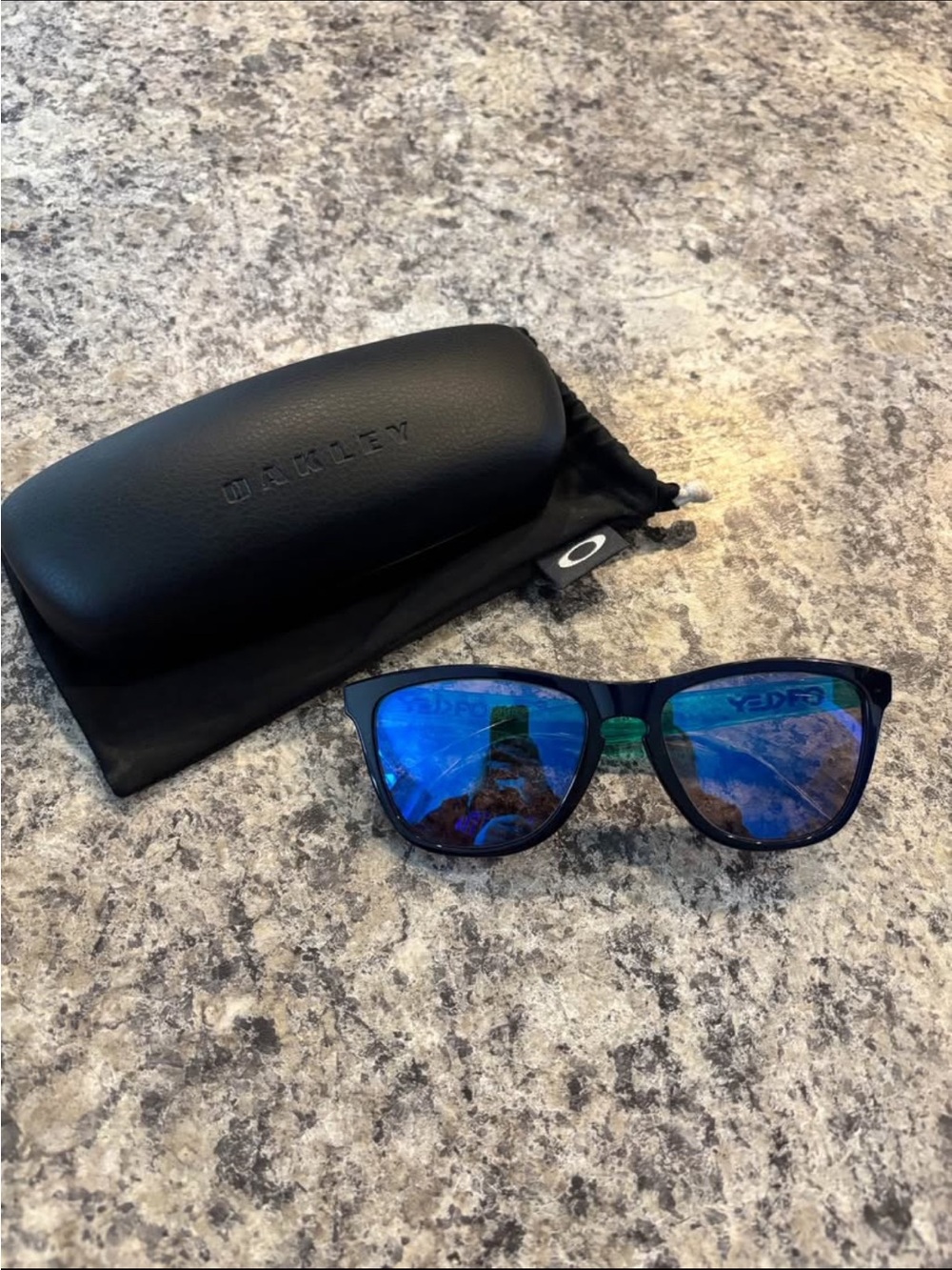 Oakley Black Frame Sunglasses with Blue Mirror Lenses